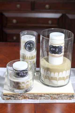 Make a rustic farmhouse centerpiece for your table or wedding reception.  Colored sand makes this project unique and easy to make!